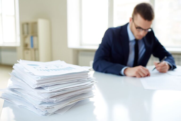 close up stack documents with executive background (2)